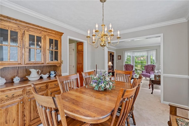 6032 Hawthorn Dr, Moon/Crescent Twp, PA 15108 - dining area with a chandelier, ornamental molding, and light colored carpet
