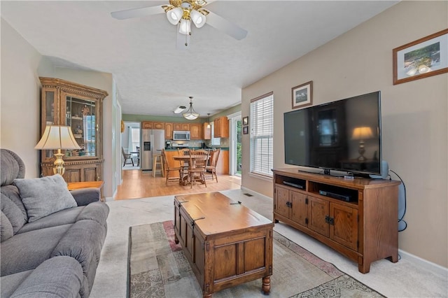 6032 Hawthorn Dr, Moon/Crescent Twp, PA 15108 - living area with a ceiling fan and baseboards