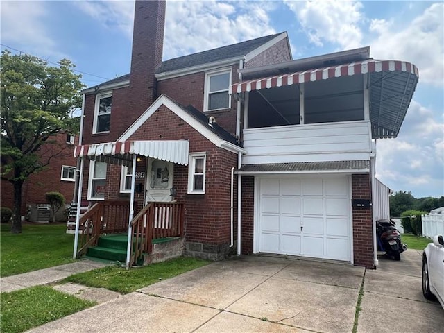 2864 Leechburg Rd, Lower Burrell, PA 15068 - view of front of home with brick siding, a chimney, a garage, and concrete driveway