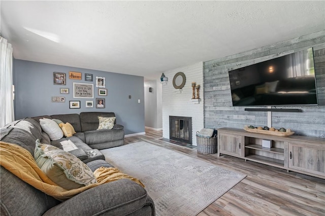160 Sonnie Dr, Salem Twp Wml, PA 15624 - living room with wood finished floors and a fireplace