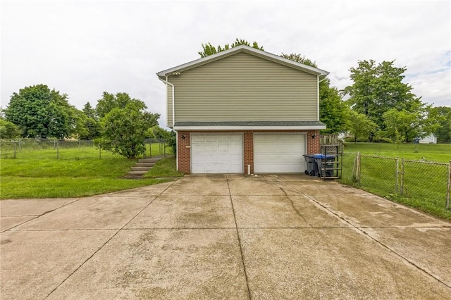 4835 Sterrettania Rd, Millcreek Twp Eri, PA 16506 - view of property exterior featuring brick siding, concrete driveway, and an attached garage