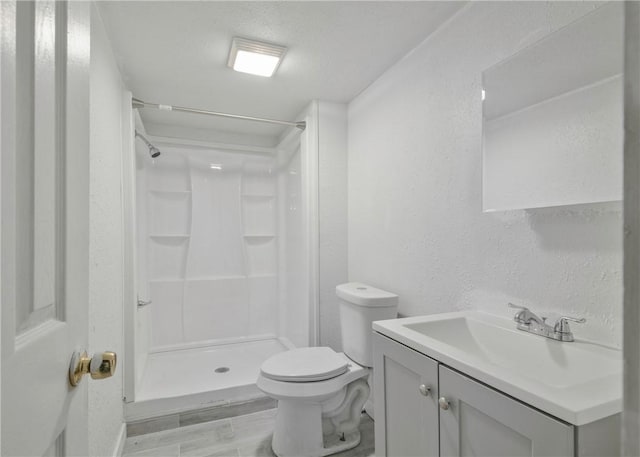 1709 Main St, Aliquippa, PA 15001 - bathroom featuring a shower stall, vanity, and a textured wall