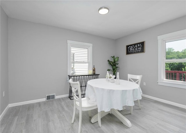 1709 Main St, Aliquippa, PA 15001 - dining area with light wood-style floors and baseboards