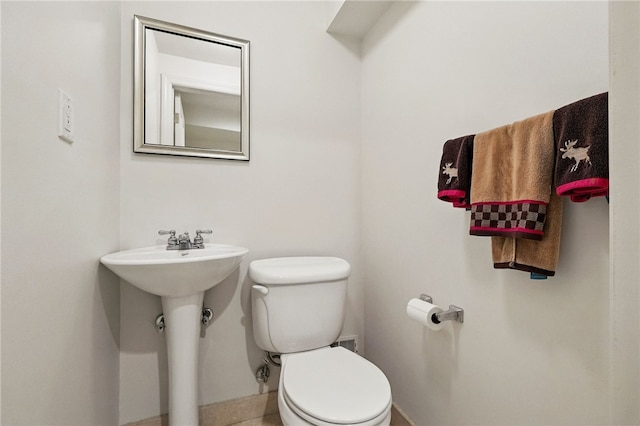 1606 Merriman Ct, South Side, PA 15203 - bathroom featuring toilet and baseboards