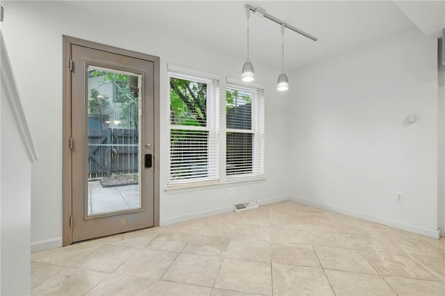 1606 Merriman Ct, South Side, PA 15203 - unfurnished dining area with light tile patterned flooring and baseboards
