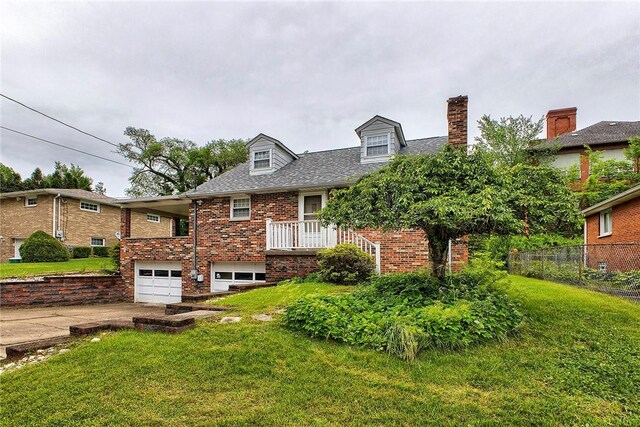 712 N 2nd St, Jeannette, PA 15644 - cape cod-style house featuring driveway, an attached garage, brick siding, and a chimney