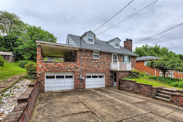 712 N 2nd St, Jeannette, PA 15644 - view of front facade with brick siding, an attached garage, driveway, and a chimney