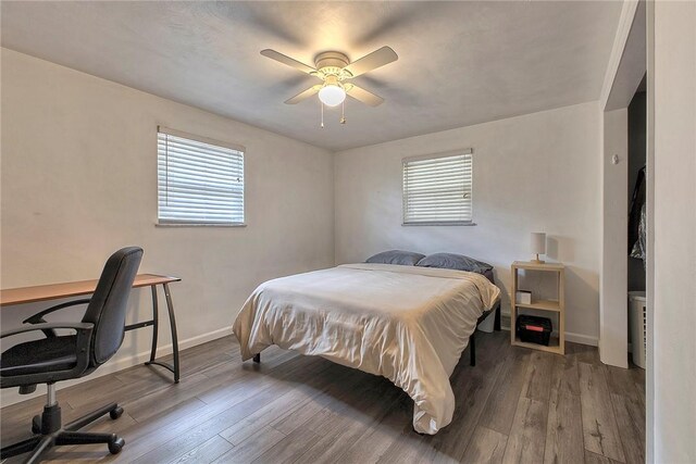 712 N 2nd St, Jeannette, PA 15644 - bedroom with wood finished floors, a desk, and a ceiling fan