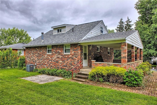 712 N 2nd St, Jeannette, PA 15644 - back of house featuring brick siding, a yard, and a shingled roof