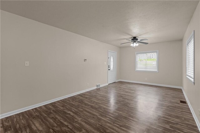 2960 Brevard Ave, Brentwood, PA 15227 - empty room with a ceiling fan, dark wood finished floors, and a textured ceiling
