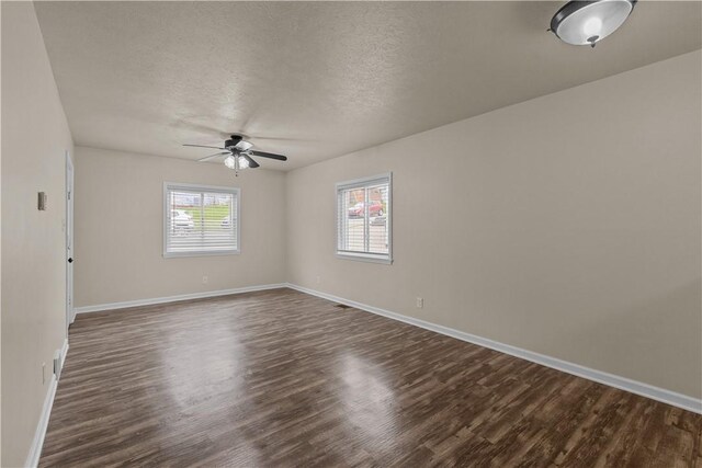 2960 Brevard Ave, Brentwood, PA 15227 - unfurnished room with a ceiling fan, dark wood-style flooring, and a textured ceiling