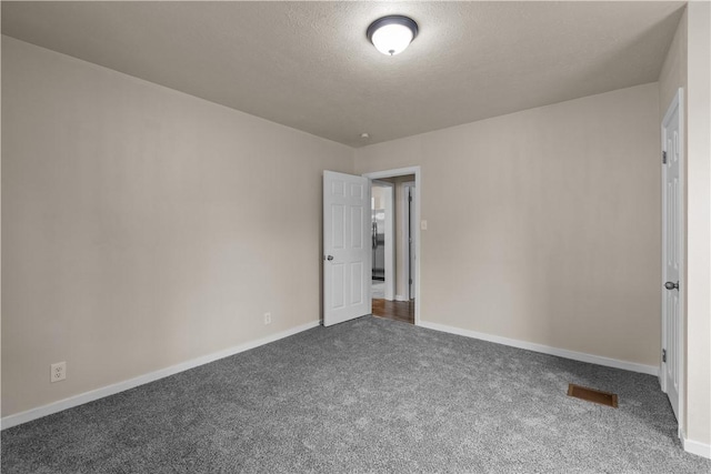 2960 Brevard Ave, Brentwood, PA 15227 - empty room featuring dark colored carpet and a textured ceiling