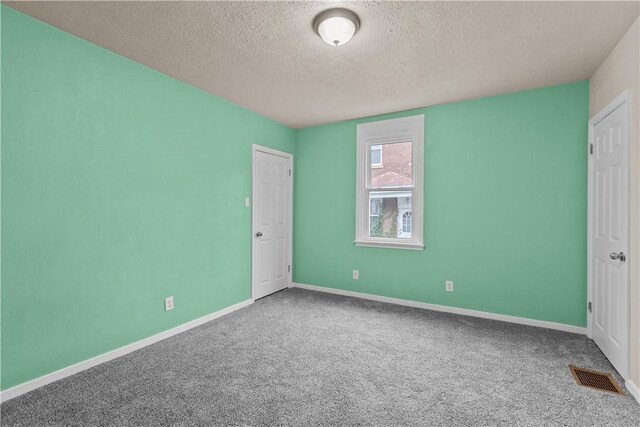 2960 Brevard Ave, Brentwood, PA 15227 - unfurnished bedroom with a textured ceiling and carpet