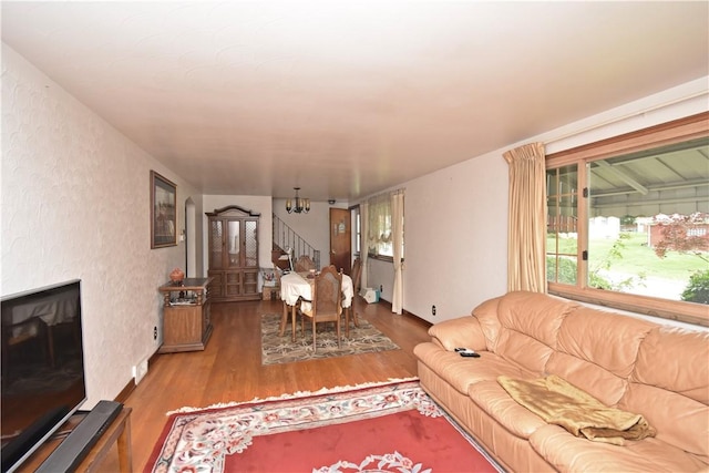 104 Sherwick Dr, Elizabeth Twp/Boro, PA 15037 - living room featuring stairs, wood finished floors, and a chandelier