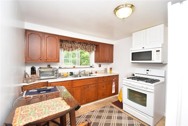 104 Sherwick Dr, Elizabeth Twp/Boro, PA 15037 - kitchen featuring white appliances, light countertops, brown cabinets, and light tile patterned floors