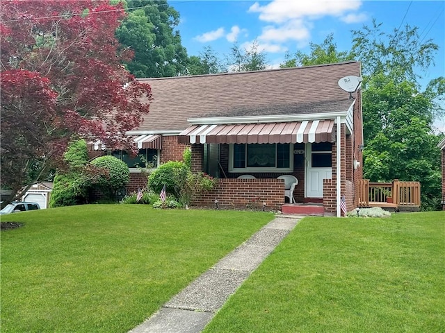 104 Sherwick Dr, Elizabeth Twp/Boro, PA 15037 - view of front of home with roof with shingles, brick siding, and a front lawn
