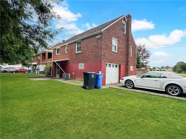 104 Sherwick Dr, Elizabeth Twp/Boro, PA 15037 - back of house with a garage, a yard, a chimney, brick siding, and driveway
