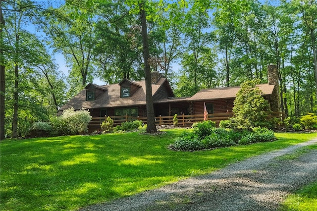 125 Timber Ridge Rd, Clinton Twp, PA 16056 - log-style house with a front yard, log exterior, driveway, and a chimney
