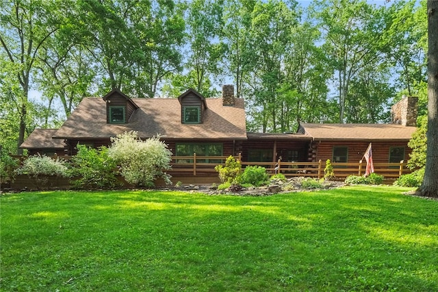125 Timber Ridge Rd, Clinton Twp, PA 16056 - back of house with a chimney, a lawn, log exterior, and a deck