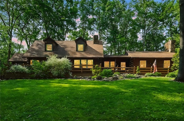 125 Timber Ridge Rd, Clinton Twp, PA 16056 - back of house at dusk featuring a yard and a chimney