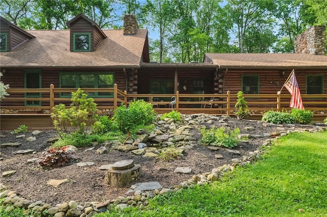 125 Timber Ridge Rd, Clinton Twp, PA 16056 - view of front facade featuring a chimney, log siding, a shingled roof, and a deck
