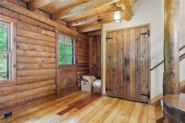 125 Timber Ridge Rd, Clinton Twp, PA 16056 - foyer featuring hardwood / wood-style flooring, log walls, and a wooden ceiling with exposed beams