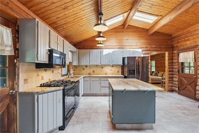125 Timber Ridge Rd, Clinton Twp, PA 16056 - kitchen with black appliances, stone finish flooring, a center island, a skylight, and backsplash