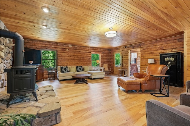 125 Timber Ridge Rd, Clinton Twp, PA 16056 - living room featuring a wood stove, wooden ceiling, light wood-style flooring, and rustic walls