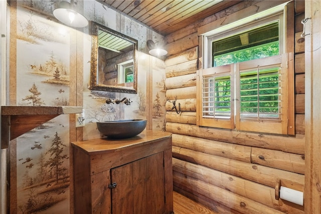 125 Timber Ridge Rd, Clinton Twp, PA 16056 - bathroom featuring vanity, rustic walls, wood ceiling, and wood finished floors