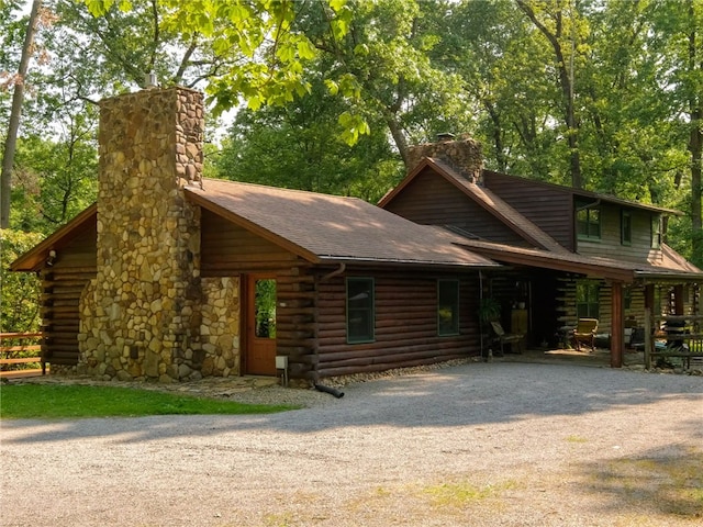 125 Timber Ridge Rd, Clinton Twp, PA 16056 - log home with a chimney, log exterior, driveway, and roof with shingles