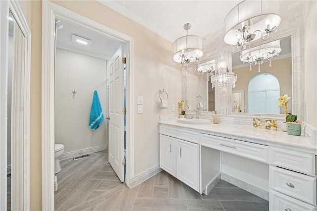 11 Sunset Ct, Cranberry Twp, PA 16066 - bathroom with vanity, a chandelier, and ornamental molding
