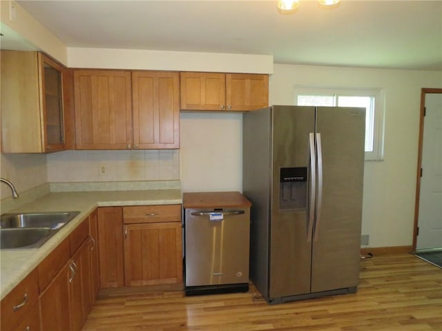 1332 Oakridge Rd, South Fayette, PA 15057 - kitchen with stainless steel refrigerator with ice dispenser, light wood-type flooring, and brown cabinets