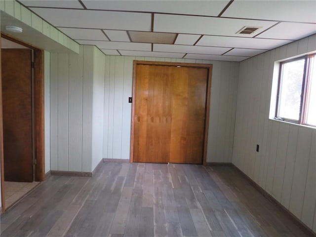 1332 Oakridge Rd, South Fayette, PA 15057 - unfurnished room with hardwood / wood-style flooring, a paneled ceiling, a smoke detector, and wooden walls