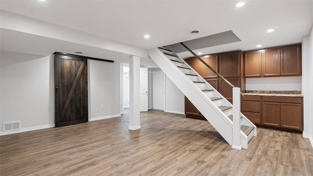 1127 State Route 885, Jefferson Hills, PA 15025 - finished basement with light wood-type flooring, stairs, recessed lighting, and a barn door