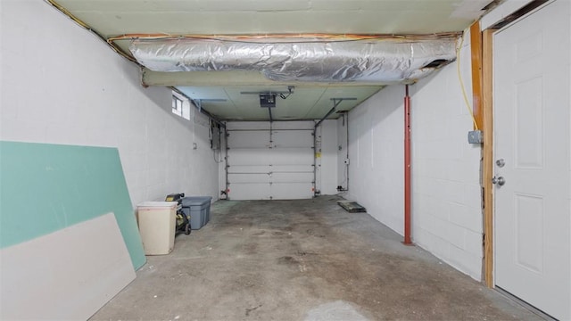 1127 State Route 885, Jefferson Hills, PA 15025 - garage with a garage door opener and concrete block wall