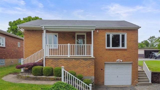 1127 State Route 885, Jefferson Hills, PA 15025 - view of front of house with stairway, brick siding, an attached garage, covered porch, and roof with shingles