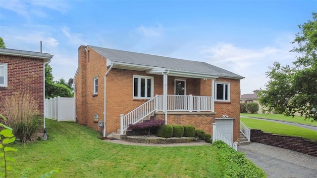 1127 State Route 885, Jefferson Hills, PA 15025 - view of front of property with an attached garage, asphalt driveway, brick siding, and a porch