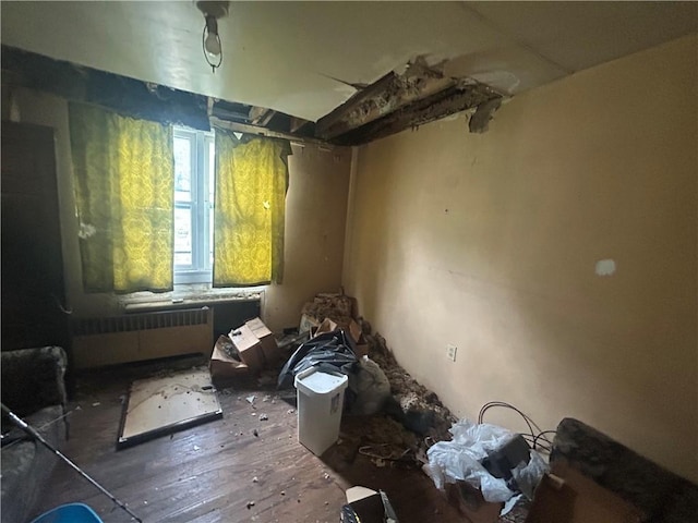 2607 Spring St, Arlington, PA 15210 - miscellaneous room featuring radiator heating unit and wood-type flooring