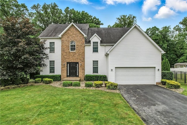 1603 Lori Ln, Hermitage, PA 16148 - view of front of property with asphalt driveway, brick siding, a shingled roof, and an attached garage