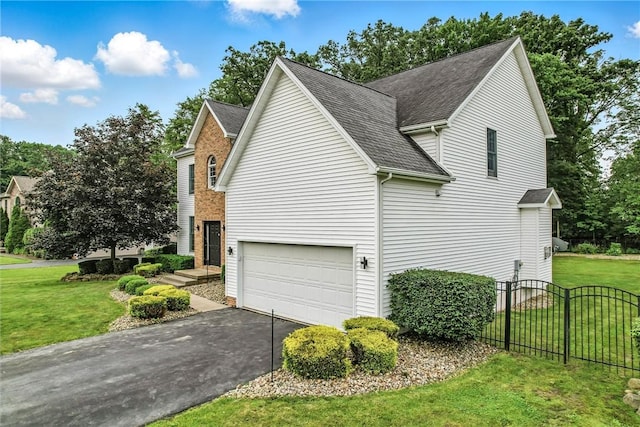 1603 Lori Ln, Hermitage, PA 16148 - view of home's exterior featuring driveway, an attached garage, and a shingled roof