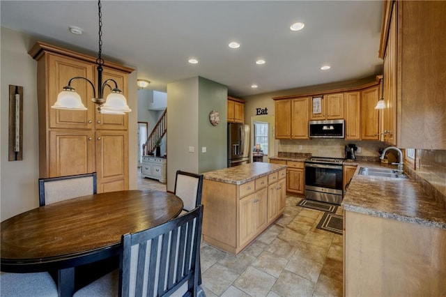1603 Lori Ln, Hermitage, PA 16148 - kitchen with appliances with stainless steel finishes, decorative backsplash, a center island, recessed lighting, and hanging light fixtures