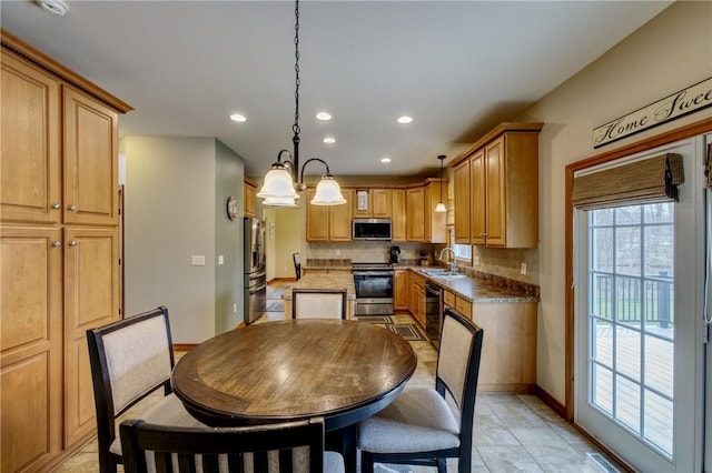 1603 Lori Ln, Hermitage, PA 16148 - kitchen featuring stainless steel appliances, recessed lighting, decorative backsplash, hanging light fixtures, and a chandelier