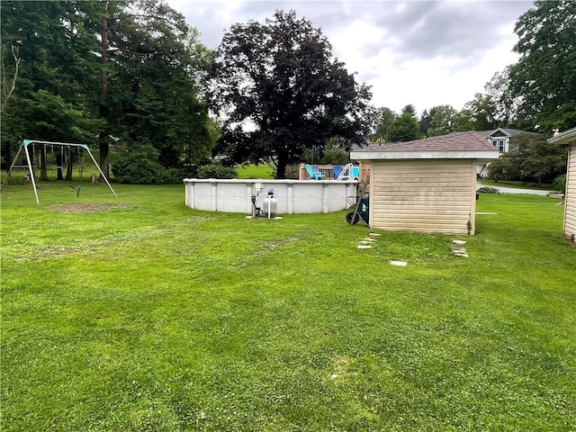 2568 Mercer St, Sandy Lake Boro, PA 16145 - view of grassy yard featuring a playground and an outdoor pool