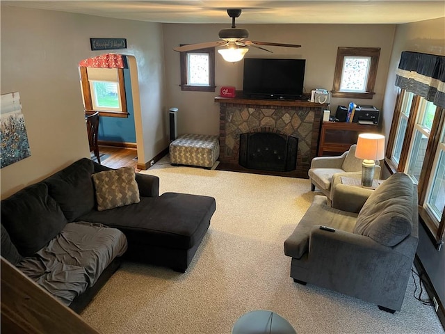 2568 Mercer St, Sandy Lake Boro, PA 16145 - living room with carpet, a ceiling fan, and a fireplace