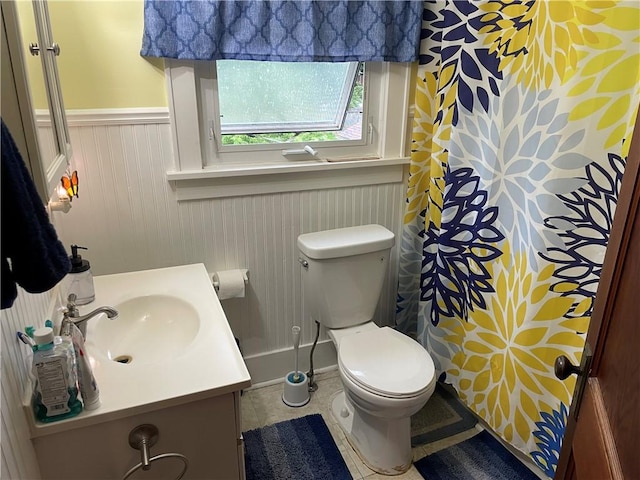2568 Mercer St, Sandy Lake Boro, PA 16145 - bathroom with a wainscoted wall, vanity, curtained shower, and tile patterned flooring