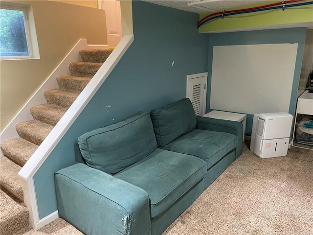 2568 Mercer St, Sandy Lake Boro, PA 16145 - living area with carpet flooring and stairway