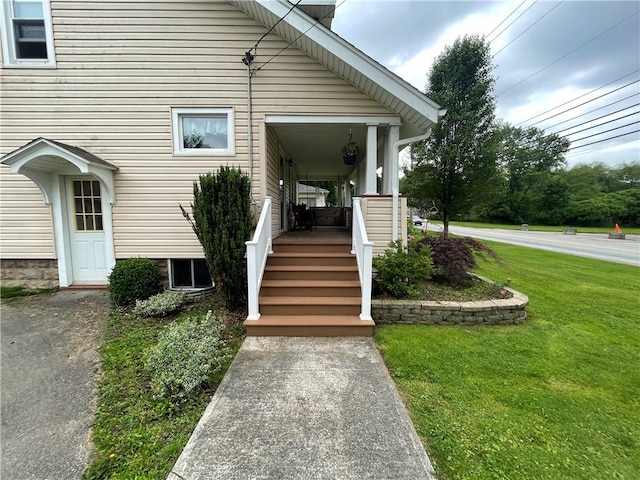 2568 Mercer St, Sandy Lake Boro, PA 16145 - view of exterior entry featuring a yard and a porch