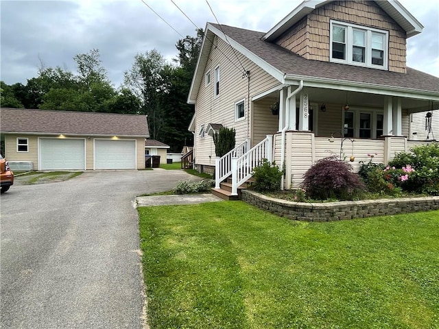 2568 Mercer St, Sandy Lake Boro, PA 16145 - view of front of house with an outdoor structure, a front lawn, a porch, and a shingled roof