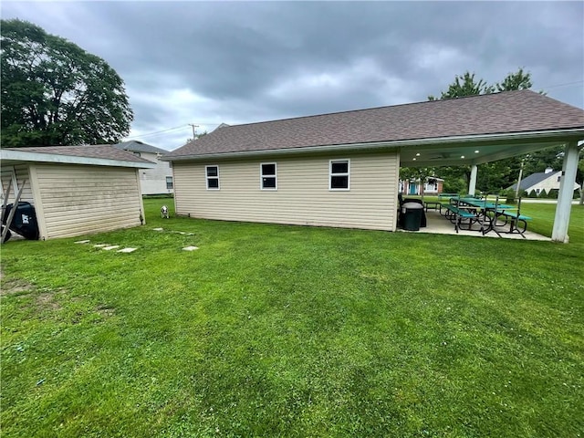 2568 Mercer St, Sandy Lake Boro, PA 16145 - back of property with a yard, a patio area, and roof with shingles