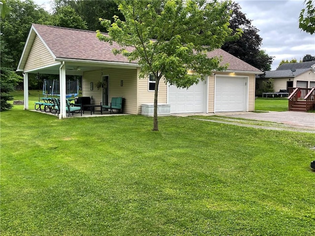 2568 Mercer St, Sandy Lake Boro, PA 16145 - back of house with roof with shingles, a yard, a detached garage, and a patio